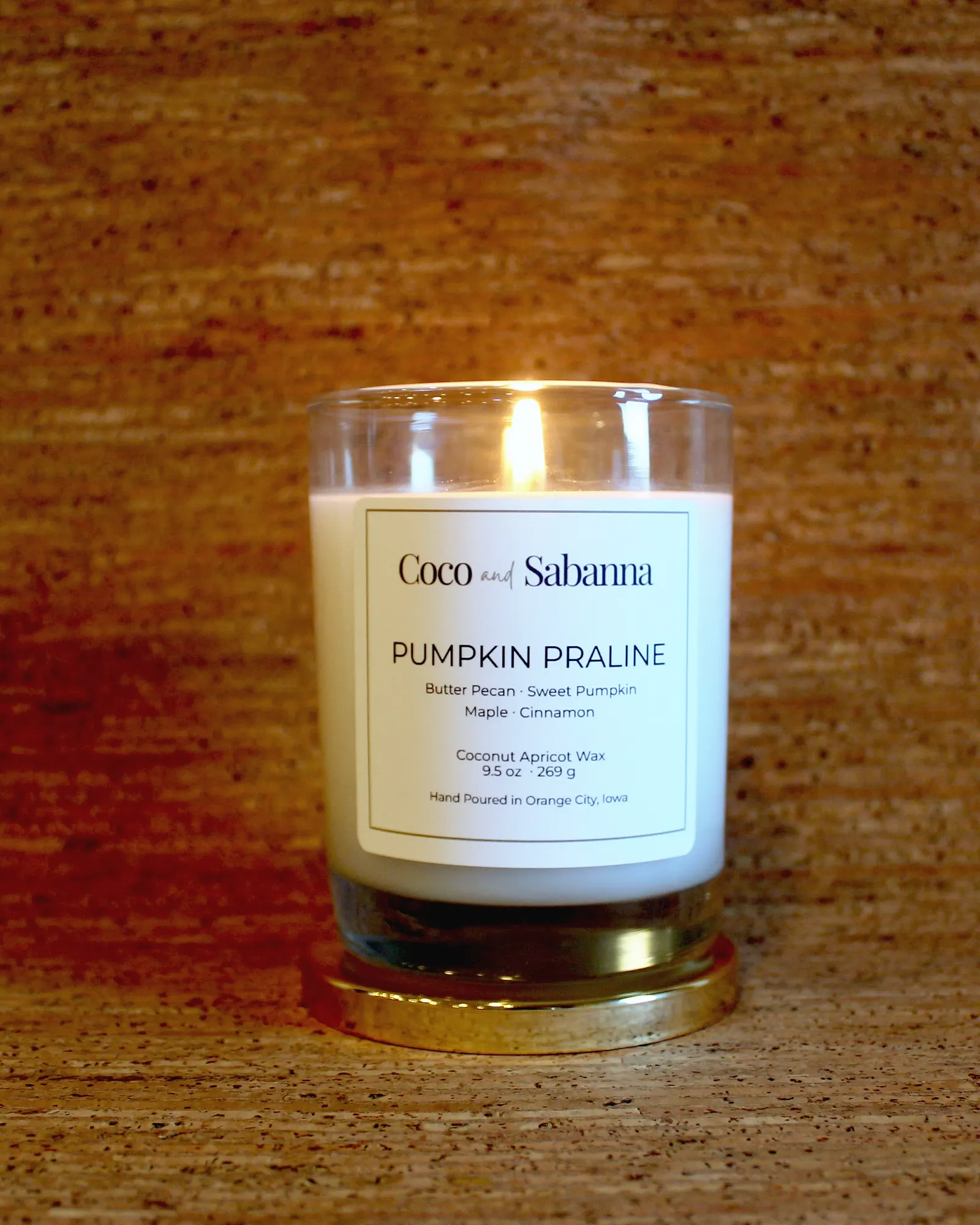 Pumpkin Praline, a hand-poured candle in a clear glass jar (9.5 oz).